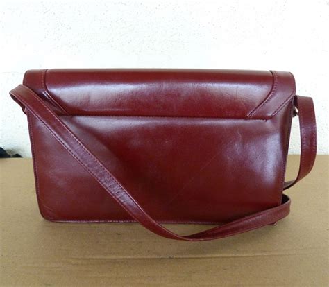 sac vintage bandoulière CARTIER cuir bordeaux ( A/G) 